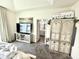 Main bedroom with tray ceilings, TV, and ensuite bathroom at 8755 Stoddard Ln, Indianapolis, IN 46217