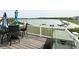 Outdoor patio with seating overlooking the lake, perfect for relaxing in scenic surroundings at 8755 Stoddard Ln, Indianapolis, IN 46217