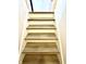 Staircase with woodgrain steps and white walls going up at 8755 Stoddard Ln, Indianapolis, IN 46217
