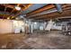 Spacious unfinished basement with exposed ceiling and concrete floor, offering ample storage at 905 E Yoke St, Indianapolis, IN 46203