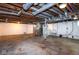 Large unfinished basement with furnace, water heater, plumbing, and a concrete floor at 905 E Yoke St, Indianapolis, IN 46203
