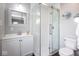 Modern bathroom features a glass shower, updated vanity and a matching decorative mirror at 905 E Yoke St, Indianapolis, IN 46203