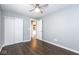 Empty bedroom with hard surface floors, ceiling fan and access to a large closet at 905 E Yoke St, Indianapolis, IN 46203