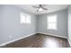 Bright bedroom featuring hardwood floors, neutral walls, and a ceiling fan at 905 E Yoke St, Indianapolis, IN 46203
