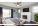 Bright bedroom features fireplace, fan, and large windows at 905 E Yoke St, Indianapolis, IN 46203