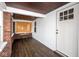 Charming enclosed porch with a unique ceiling, modern flooring, and inviting natural light at 905 E Yoke St, Indianapolis, IN 46203
