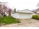 One car garage with concrete driveway and a green lawn at 905 E Yoke St, Indianapolis, IN 46203