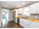 Bright kitchen featuring stainless steel appliances, white cabinets, and wood countertops at 905 E Yoke St, Indianapolis, IN 46203