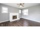 Bright Living Room features fireplace, fan, and large windows at 905 E Yoke St, Indianapolis, IN 46203