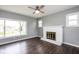 Bright Living Room features fireplace, fan, and large windows at 905 E Yoke St, Indianapolis, IN 46203