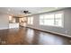 Open-concept living area with hardwood floors, recessed lighting, and seamless flow to the kitchen at 905 E Yoke St, Indianapolis, IN 46203
