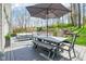 Outdoor deck area with comfortable dining and lounging, perfect for relaxing and enjoying the natural surroundings at 961 Starkey Rd, Zionsville, IN 46077
