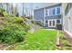 Landscaped backyard featuring a stone staircase leading to a multilevel yard, plus access to home at 961 Starkey Rd, Zionsville, IN 46077