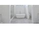 Spacious bathroom featuring a glass shower, a freestanding tub, and a separate toilet room at 961 Starkey Rd, Zionsville, IN 46077