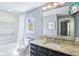 Bathroom with tub, shower, toilet, tv, mirror and vanity at 961 Starkey Rd, Zionsville, IN 46077