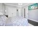 Comfortable bedroom features double closets, a mounted television and a cozy bed at 961 Starkey Rd, Zionsville, IN 46077