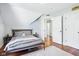 Bedroom boasts hardwood floors and neutral tones with a bed centered in the room at 961 Starkey Rd, Zionsville, IN 46077