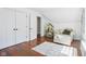 Bedroom featuring a sitting area, closet, sloped ceiling, and wood flooring at 961 Starkey Rd, Zionsville, IN 46077