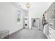 Spacious walk-in closet with custom shelving, a laundry area, and a large decorative mirror at 961 Starkey Rd, Zionsville, IN 46077