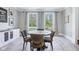 Bright dining area with large windows, neutral tones, and a view of the outdoors at 961 Starkey Rd, Zionsville, IN 46077