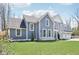 Beautifully designed two-story home with lush green lawn, featuring modern architectural detailing and ample natural light at 961 Starkey Rd, Zionsville, IN 46077