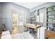 Home office featuring built-in shelving, a stylish desk, and neutral wall color, creating a productive workspace at 961 Starkey Rd, Zionsville, IN 46077