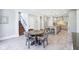 View of a bright, open kitchen and dining area with an island and updated appliances at 961 Starkey Rd, Zionsville, IN 46077