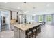 Open-concept kitchen with a large island, modern appliances, and seamless flow to the dining area, ideal for Gathering gatherings at 961 Starkey Rd, Zionsville, IN 46077