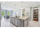 Bright kitchen features granite counters, stainless appliances, and a large island for modern living at 961 Starkey Rd, Zionsville, IN 46077