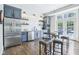Charming kitchenette with stainless steel appliances, sleek cabinetry, and bar stool seating at 961 Starkey Rd, Zionsville, IN 46077