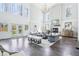Bright, open living room with fireplace, tall windows, and modern decor for sophisticated living at 961 Starkey Rd, Zionsville, IN 46077