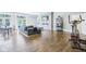 Bright living room boasts a modern fireplace, comfortable seating, and a home gym area at 961 Starkey Rd, Zionsville, IN 46077