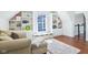 Sunlit living room boasts built-in shelves, window seat, and plush seating area at 961 Starkey Rd, Zionsville, IN 46077