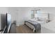 Comfortable bedroom with a window view, stylish floor lamp, and a neutral color scheme at 9664 Trail Dr, Avon, IN 46123