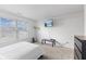 Bright bedroom with large window, mounted television, and modern furnishings at 9664 Trail Dr, Avon, IN 46123
