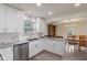 Bright kitchen with updated cabinets, granite countertops, and stainless steel dishwasher at 9664 Trail Dr, Avon, IN 46123