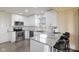 Modern kitchen featuring stainless steel appliances, gray countertops and white cabinets at 9664 Trail Dr, Avon, IN 46123