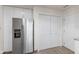 Modern kitchen with stainless steel refrigerator and updated storage at 9664 Trail Dr, Avon, IN 46123