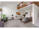 Open-concept living area with hardwood floors and plenty of natural light at 9664 Trail Dr, Avon, IN 46123