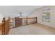Open loft area with vaulted ceilings and wooden railing overlooking the lower level at 9664 Trail Dr, Avon, IN 46123