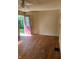 Bedroom with hardwood floors and a pink exterior door at 1105 N Livingston Ave, Indianapolis, IN 46222