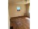 Bedroom with hardwood floors, neutral walls, a ceiling fan, and natural light at 1105 N Livingston Ave, Indianapolis, IN 46222
