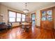 Dining room featuring wood floors, classic light fixture, and a vintage china cabinet at 1217 Evison St, Indianapolis, IN 46203