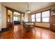 Spacious dining room with wood floors, elegant light fixture, and original trim at 1217 Evison St, Indianapolis, IN 46203