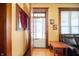 Inviting foyer with beautiful hardwood floors, and a view into the living area with its original details at 1217 Evison St, Indianapolis, IN 46203