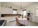 Charming kitchen with a dining area and vintage-inspired appliances, offering a cozy atmosphere at 1217 Evison St, Indianapolis, IN 46203
