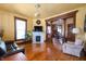 Cozy living room featuring a decorative fireplace, hardwood floors, and classic architectural details at 1217 Evison St, Indianapolis, IN 46203