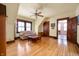 Bright living room with hardwood floors, natural light, and a ceiling fan at 1217 Evison St, Indianapolis, IN 46203