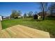 View from the deck into backyard with tree coverage and a shed at 12731 Slippery Rock Rd, Indianapolis, IN 46236