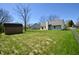 Spacious backyard featuring a shed and a well-maintained lawn, perfect for outdoor activities at 12731 Slippery Rock Rd, Indianapolis, IN 46236